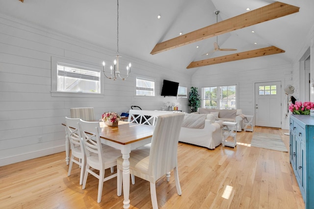 dining space featuring a chandelier, light wood-type flooring, beamed ceiling, recessed lighting, and high vaulted ceiling