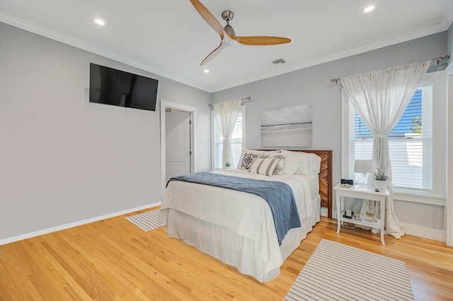 bedroom featuring crown molding, baseboards, light wood-type flooring, recessed lighting, and a ceiling fan