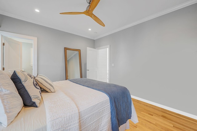 bedroom with wood finished floors, recessed lighting, baseboards, ornamental molding, and a ceiling fan