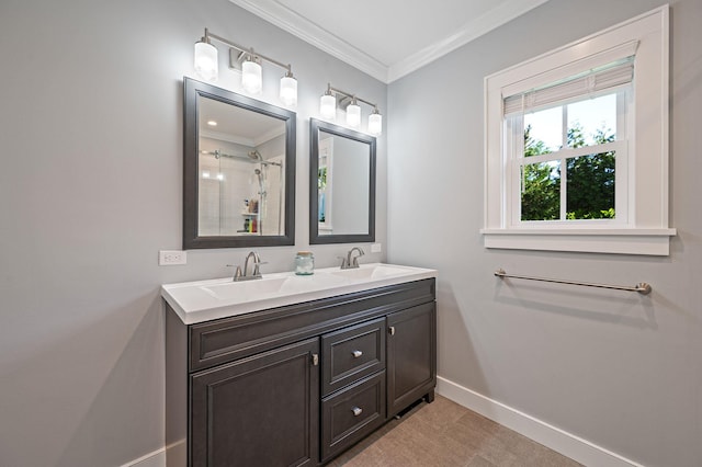bathroom with baseboards, ornamental molding, a shower, and double vanity