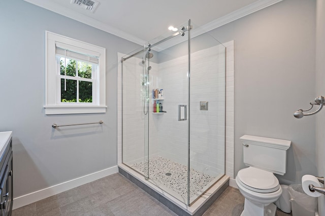full bathroom with a shower stall, baseboards, toilet, ornamental molding, and vanity