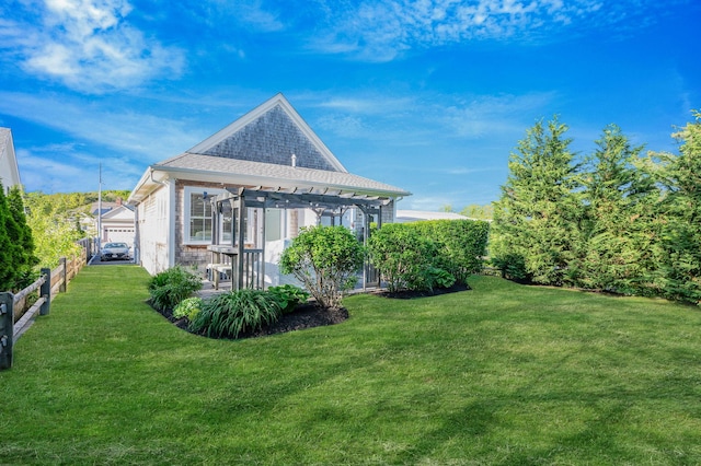 view of side of home featuring a pergola and a patio area
