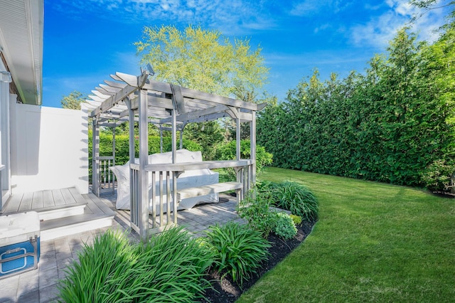 view of grassy yard featuring a pergola and a deck