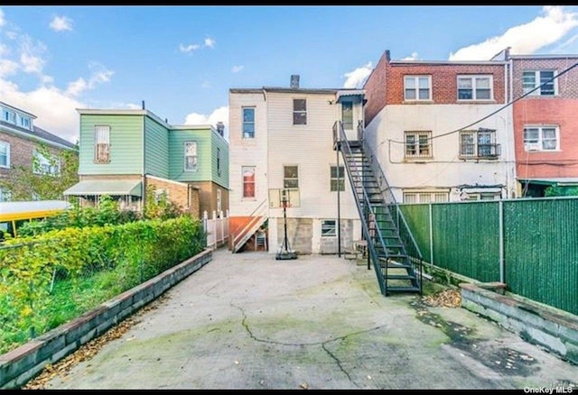 832 E 224th St, Bronx, NY 10466 - back of property featuring fence and stairway