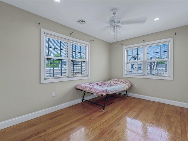 bedroom featuring baseboards, wood finished floors, recessed lighting, and a ceiling fan