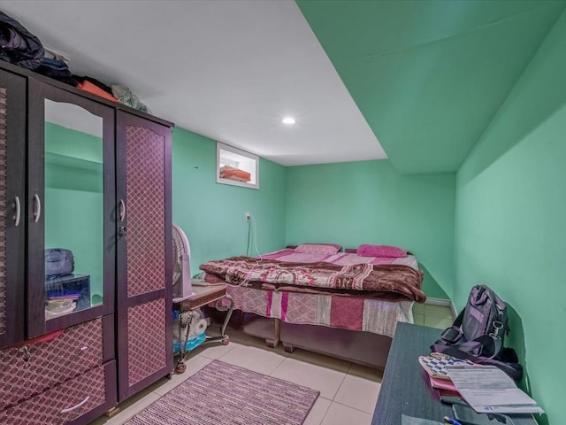bedroom with tile patterned flooring and recessed lighting