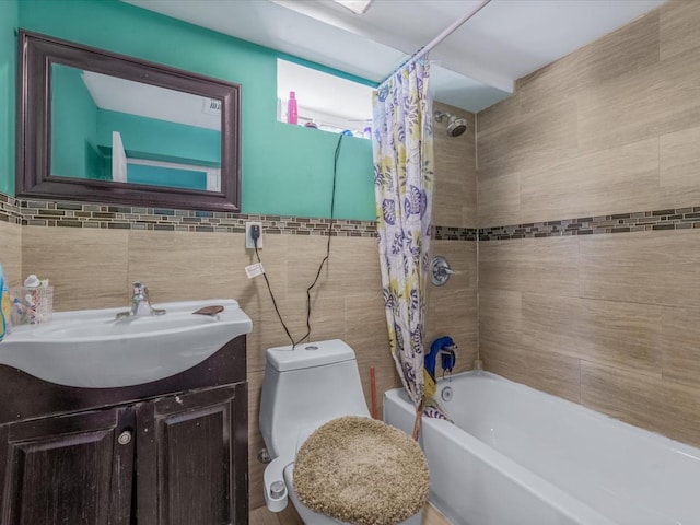 full bathroom featuring shower / tub combo, tile walls, toilet, and vanity
