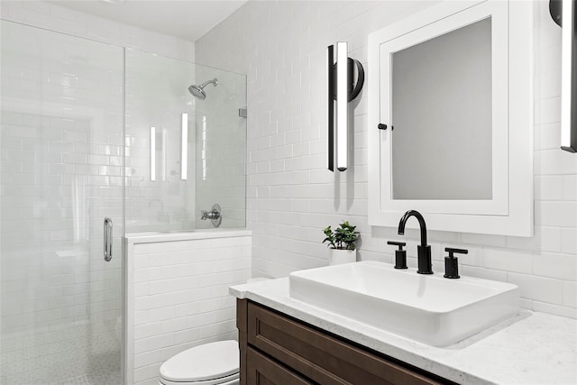 15 Wagamon Dr, Woodbury, NY 11797 - full bath with a stall shower, vanity, toilet, tile walls, and backsplash