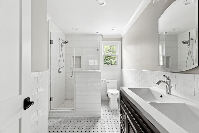 15 Wagamon Dr, Woodbury, NY 11797 - bathroom featuring tile walls, a stall shower, vanity, toilet, and a wainscoted wall