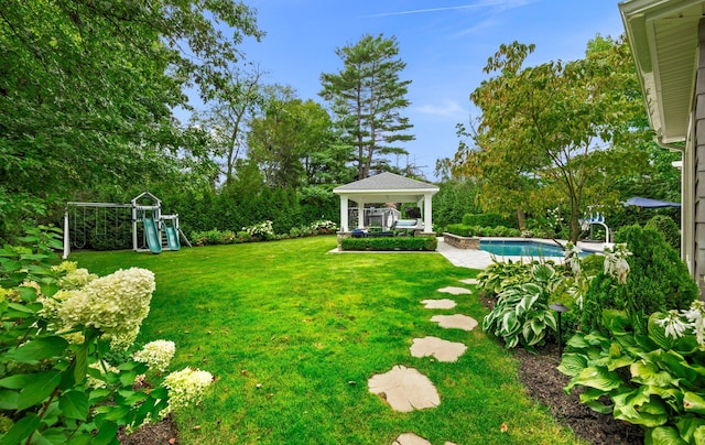 15 Wagamon Dr, Woodbury, NY 11797 - view of green lawn with a gazebo, an outdoor pool, and a playground