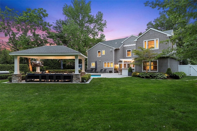 15 Wagamon Dr, Woodbury, NY 11797 - back of house at dusk with a gazebo, a patio, and an outdoor pool
