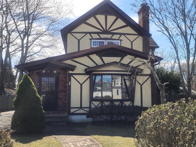 doorway to property featuring a chimney and stucco siding