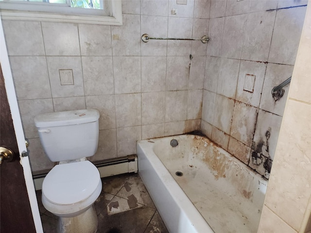 full bathroom with a baseboard heating unit, toilet, a bathtub, and tile walls