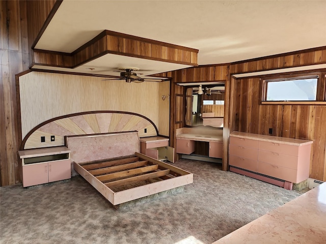 unfurnished bedroom with wooden walls and carpet floors