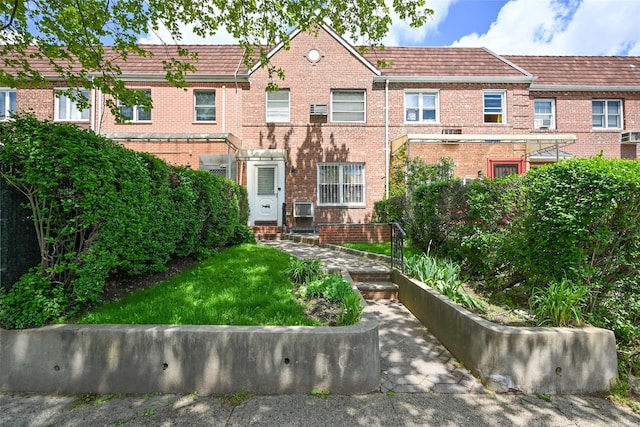 townhome / multi-family property with brick siding