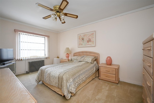 bedroom with radiator, light colored carpet, crown molding, baseboards, and a ceiling fan
