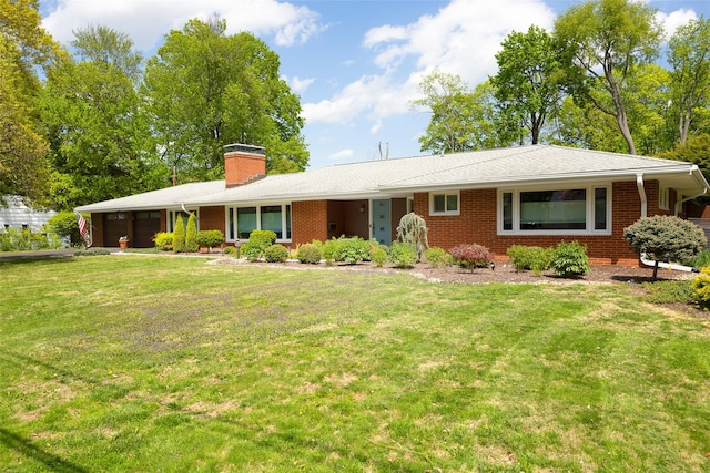 single story home with an attached garage, a front lawn, a chimney, brick siding, and asphalt driveway