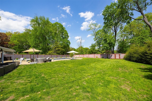 view of yard with an outdoor living space and a patio