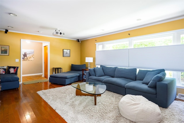 living area featuring plenty of natural light, ornamental molding, dark wood-type flooring, and baseboards