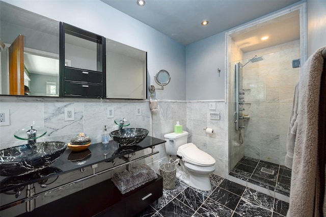 bathroom with a shower stall, marble finish floors, toilet, recessed lighting, and double vanity