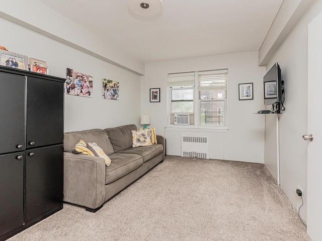 carpeted living room featuring radiator heating unit and cooling unit
