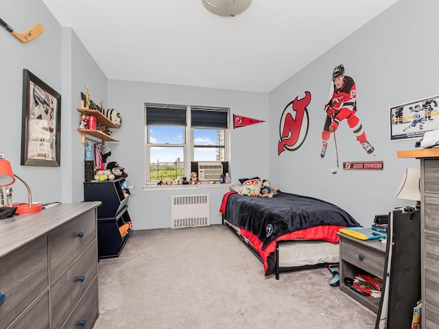 bedroom featuring radiator, carpet, and cooling unit