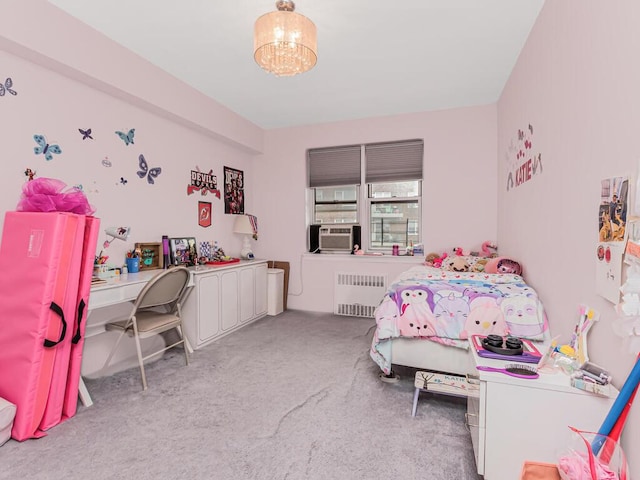 carpeted bedroom featuring radiator, a chandelier, a desk, and cooling unit