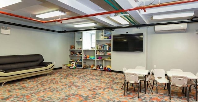 playroom featuring a wall unit AC