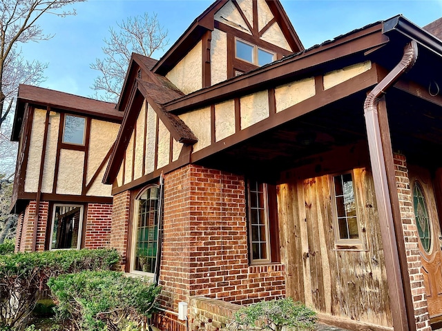 59 Sunset Rd, Bay Shore, NY 11706 - view of property exterior featuring brick siding and stucco siding