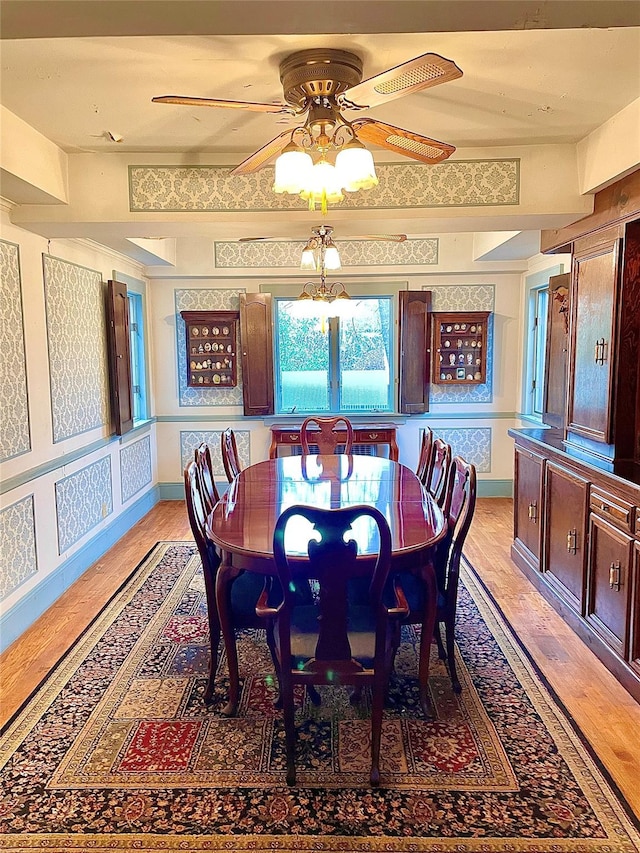 59 Sunset Rd, Bay Shore, NY 11706 - dining space featuring light wood-style flooring, a ceiling fan, and baseboards