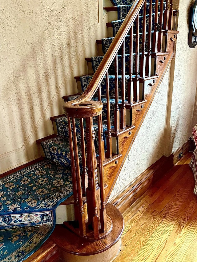 59 Sunset Rd, Bay Shore, NY 11706 - stairway featuring wood finished floors and baseboards