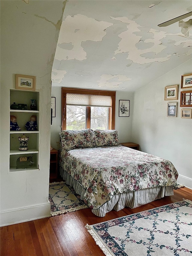 59 Sunset Rd, Bay Shore, NY 11706 - bedroom featuring vaulted ceiling, wood finished floors, and baseboards