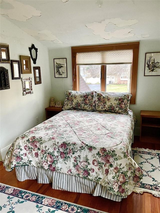 59 Sunset Rd, Bay Shore, NY 11706 - bedroom with wood finished floors and lofted ceiling