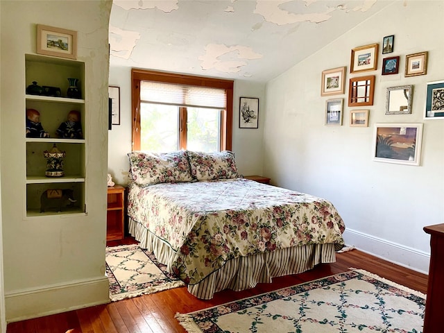 59 Sunset Rd, Bay Shore, NY 11706 - bedroom featuring hardwood / wood-style floors, vaulted ceiling, and baseboards