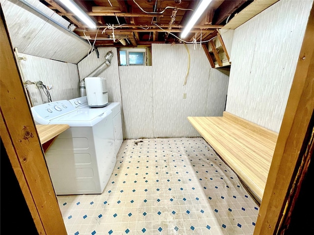 59 Sunset Rd, Bay Shore, NY 11706 - washroom with washer and clothes dryer and tile patterned floors