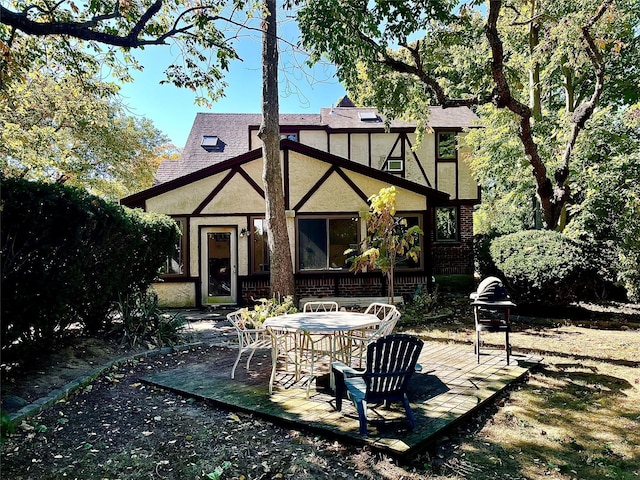 59 Sunset Rd, Bay Shore, NY 11706 - back of house featuring stucco siding, a patio, and brick siding