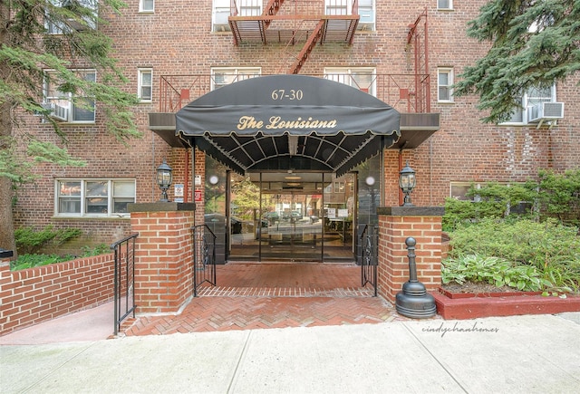 67-30 Clyde St Unit 6W, Forest Hills, NY 11375 - entrance to property featuring brick siding and cooling unit