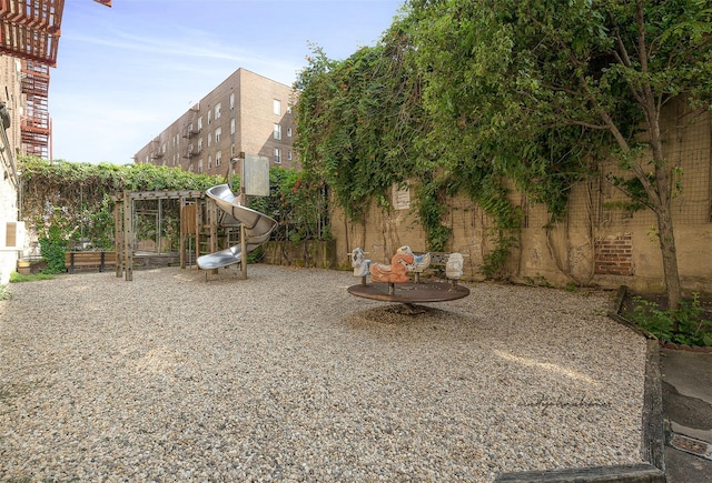67-30 Clyde St Unit 6W, Forest Hills, NY 11375 - view of yard with fence