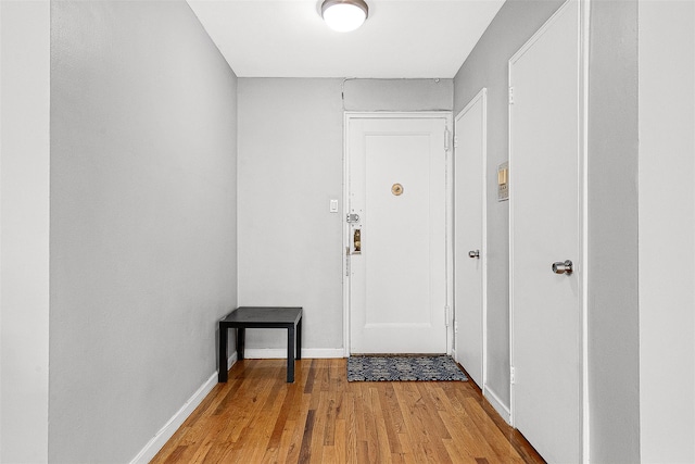 67-30 Clyde St Unit 6W, Forest Hills, NY 11375 - doorway with light wood-style flooring and baseboards
