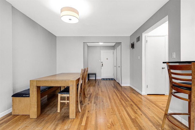 67-30 Clyde St Unit 6W, Forest Hills, NY 11375 - dining room featuring light wood-style flooring and baseboards