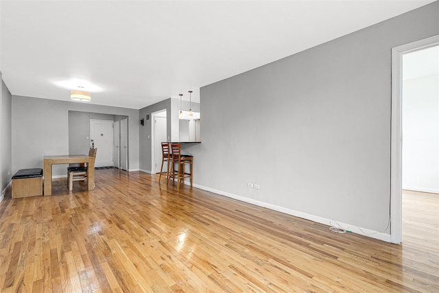 67-30 Clyde St Unit 6W, Forest Hills, NY 11375 - unfurnished living room with light wood-type flooring and baseboards