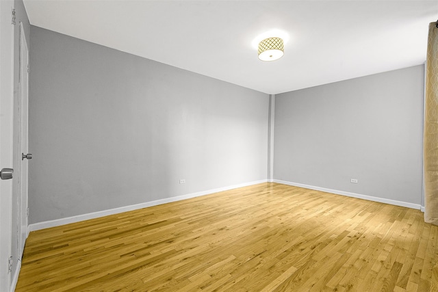 67-30 Clyde St Unit 6W, Forest Hills, NY 11375 - spare room with light wood-type flooring and baseboards