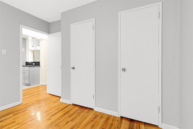 67-30 Clyde St Unit 6W, Forest Hills, NY 11375 - unfurnished bedroom with light wood-style floors and baseboards