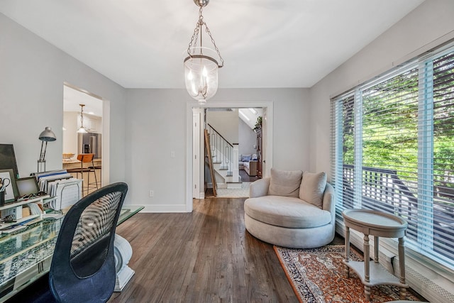 office area with wood finished floors and baseboards
