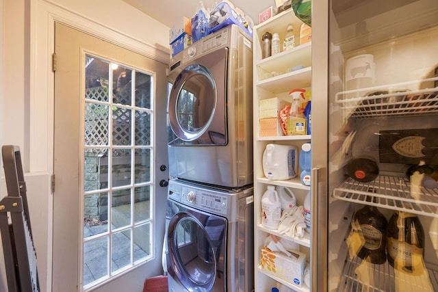 clothes washing area with stacked washer / drying machine