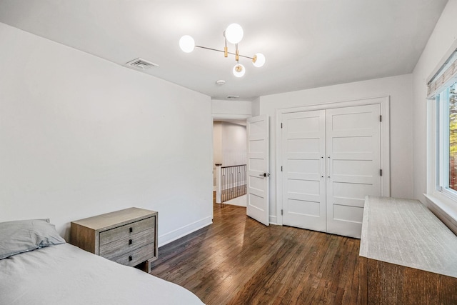 bedroom featuring wood finished floors and a closet