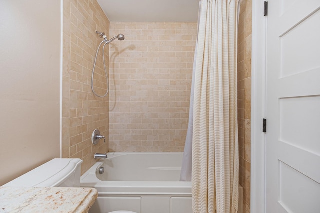 full bath with shower / bath combo, toilet, and vanity