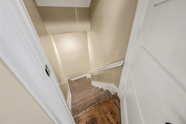 stairs featuring baseboards