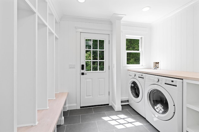 clothes washing area featuring washer and dryer, ornamental molding, dark tile patterned flooring, baseboards, and recessed lighting
