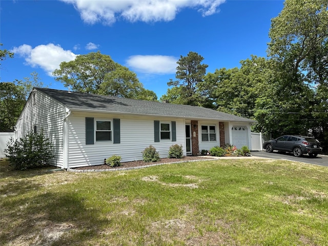 23 Hawkins Path, Coram, NY 11727 - ranch-style house featuring a garage, concrete driveway, and a front yard